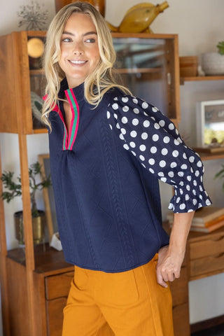 The Tessa Polkadot Contrast Sleeve Braided Knit Top