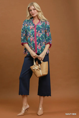 The Amy Abstract Print Ruffled Neck Top with Solid Contrast Detail